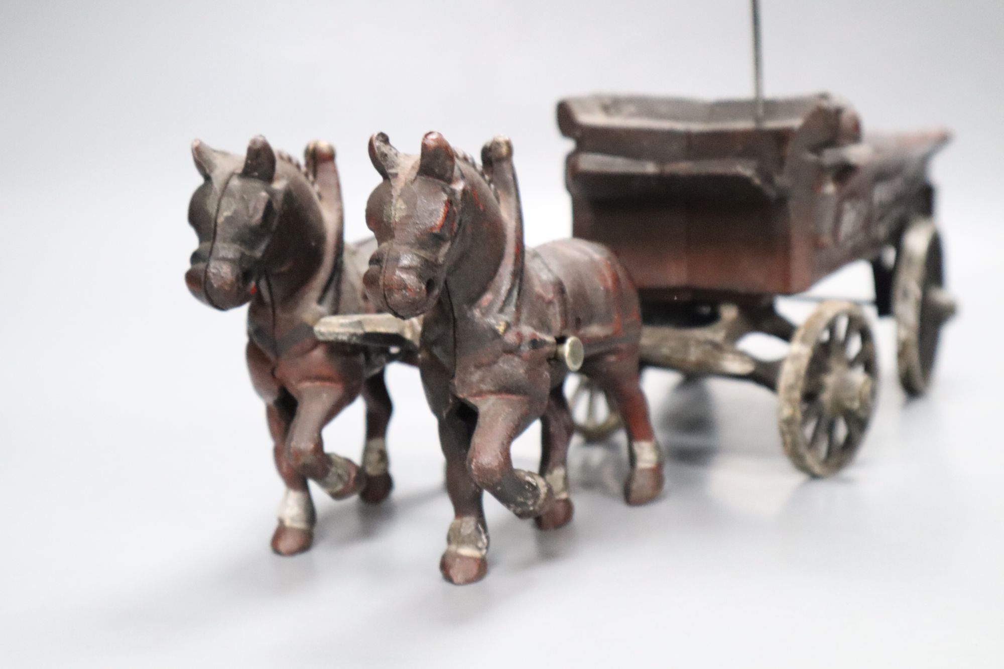 A cast iron model of a horse and carriage, length 37.5cm